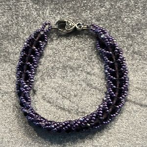 crafted lavender pearl & purple crystal beaded bracelet w/silver tone clasp.